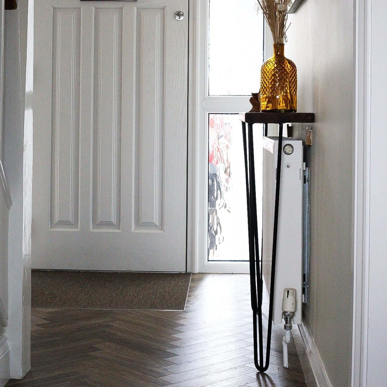 Side view of rustic radiator cover, showing industrial steel legs