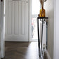 Side view of rustic radiator cover, showing industrial steel legs